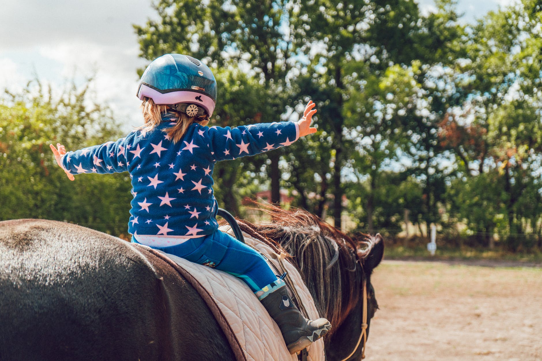 girl riding black horse