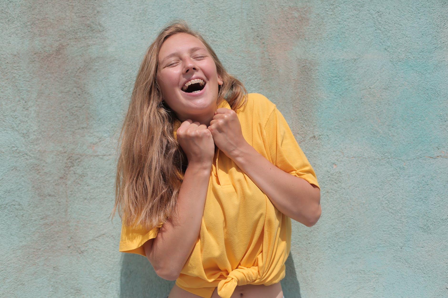 jolly woman in yellow polo shirt