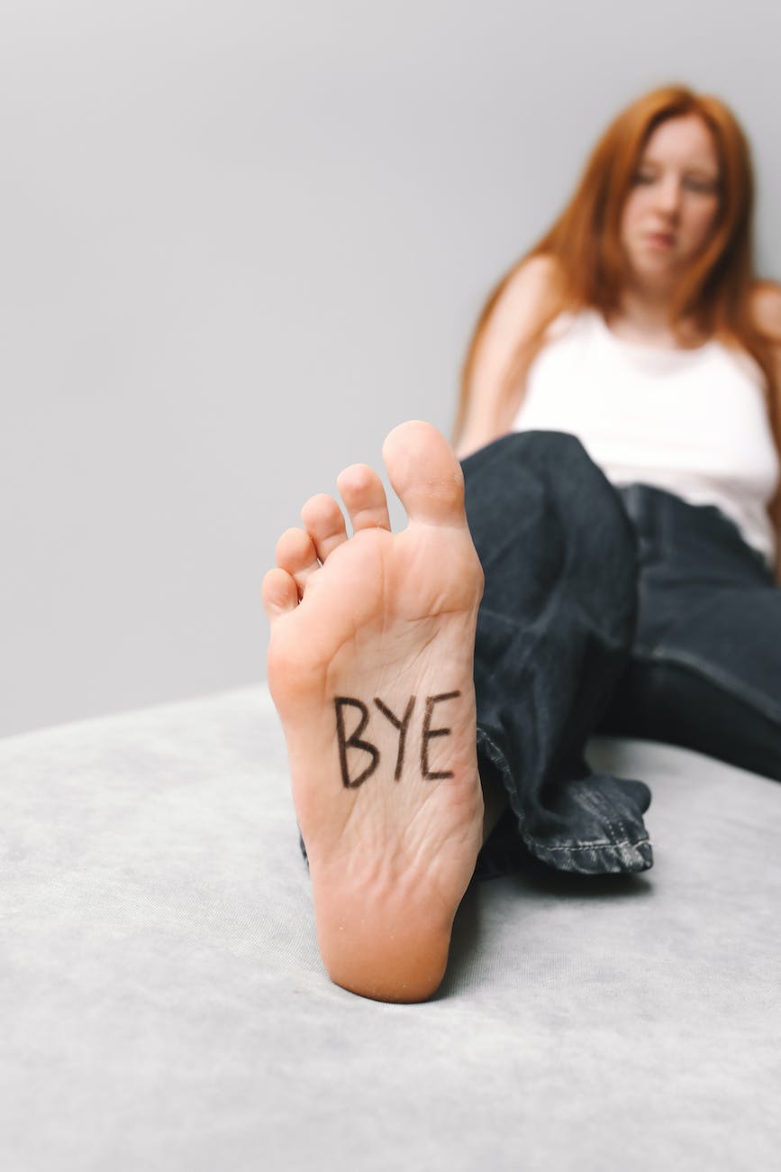 woman with word bye on her foot