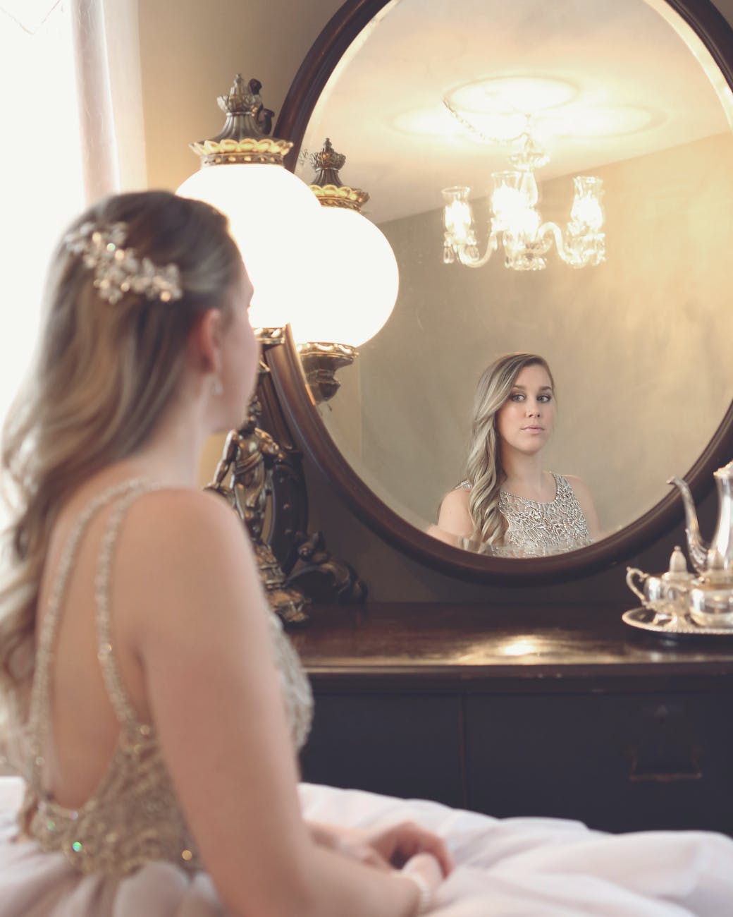 woman looking at mirror