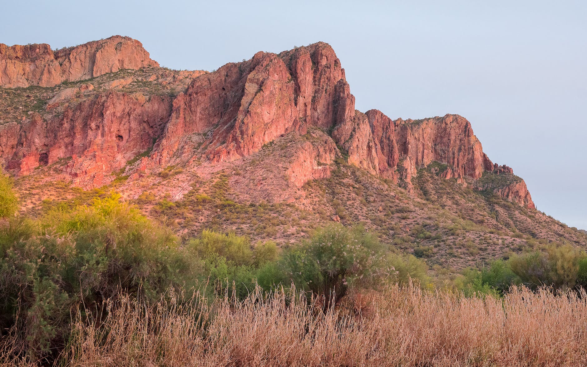 brown rock formation under white sky